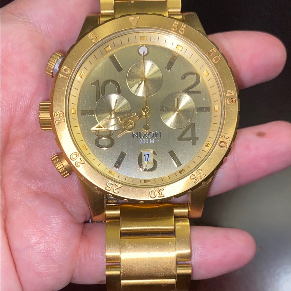 Nixon Gold Chronograph Watch with Metallic Bracelet